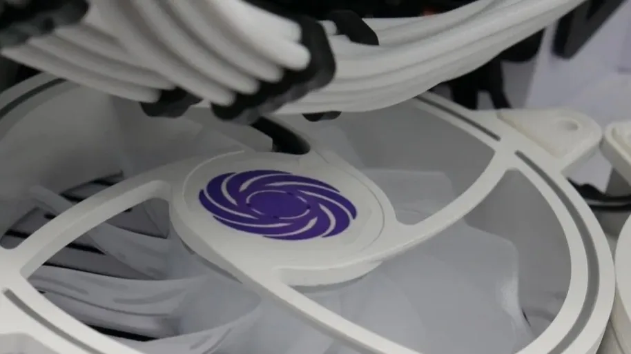 Bottomline Thermals branded fan inside a completed custom gaming PC